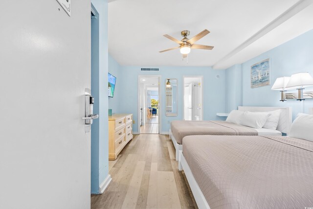 bedroom featuring light hardwood / wood-style flooring and ceiling fan