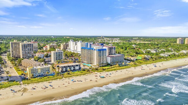 drone / aerial view featuring a beach view and a water view