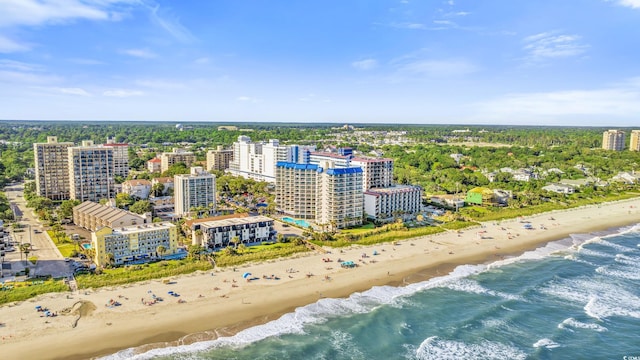 bird's eye view with a city view, a beach view, and a water view