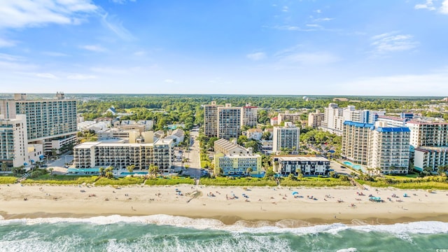 birds eye view of property with a view of the beach and a water view