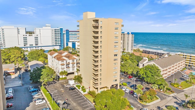 drone / aerial view featuring a view of the beach and a water view