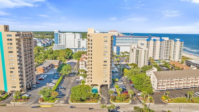 drone / aerial view with a city view and a water view