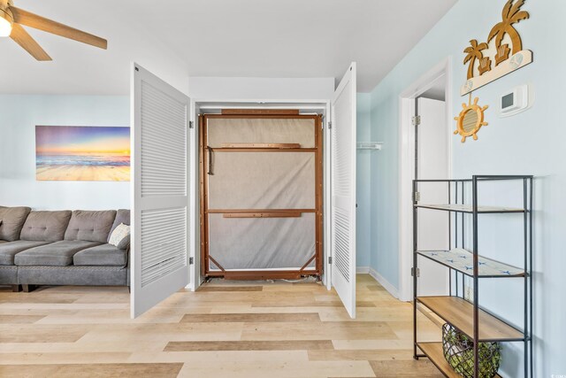 hall with light hardwood / wood-style flooring