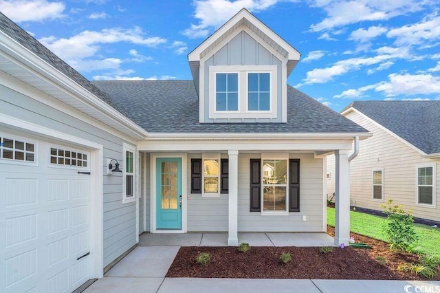 property entrance featuring covered porch and a garage