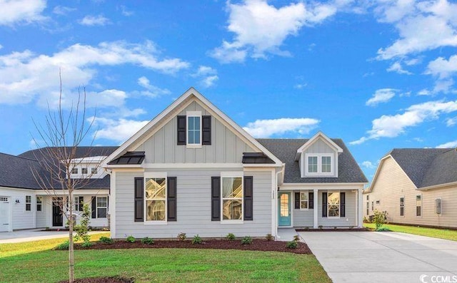 view of front of property with covered porch and a front yard