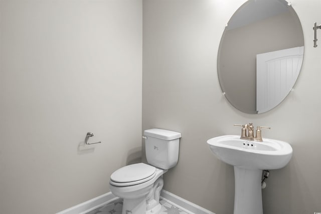 bathroom featuring toilet