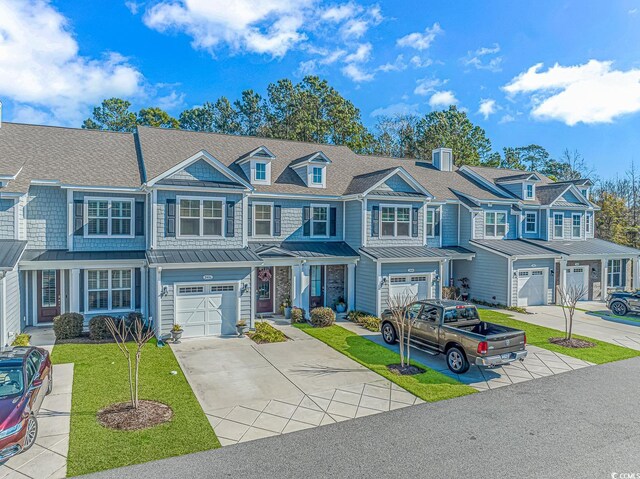 townhome / multi-family property featuring a garage