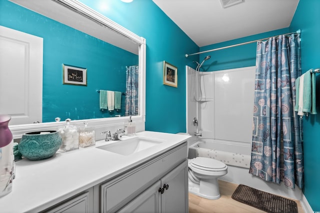 full bathroom with vanity, wood-type flooring, toilet, and shower / bath combo with shower curtain