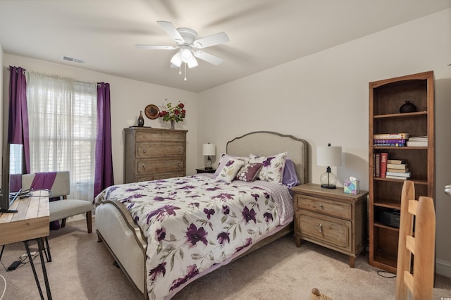 bedroom with light colored carpet and ceiling fan