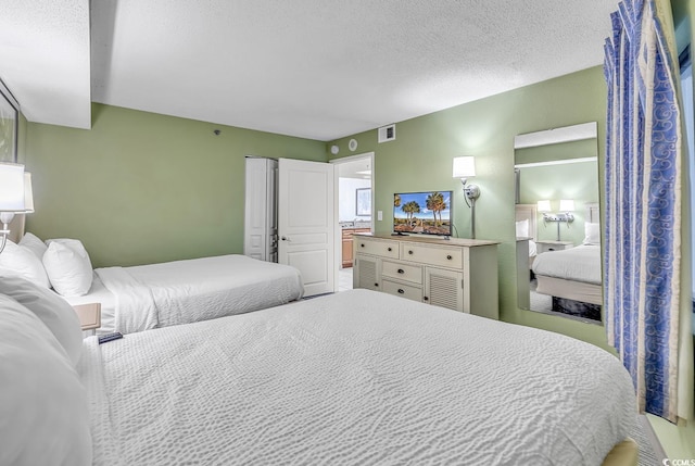 bedroom featuring a textured ceiling