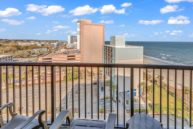 balcony with a beach view and a water view