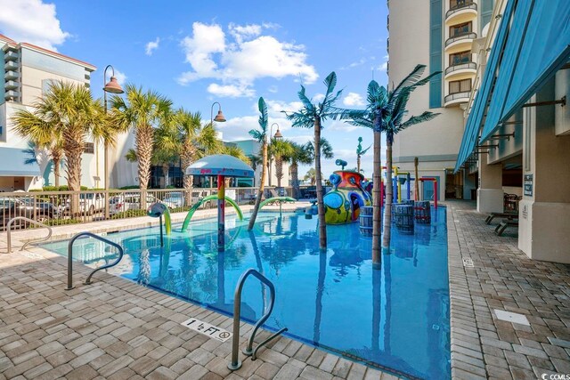 view of swimming pool featuring a patio area