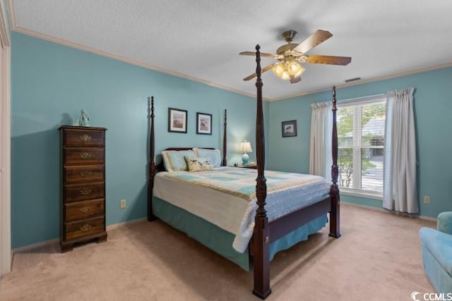 bedroom featuring ceiling fan, light colored carpet, crown molding, and a textured ceiling