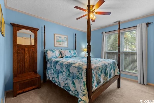 carpeted bedroom featuring a textured ceiling, ceiling fan, and ornamental molding