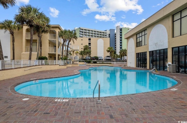 view of swimming pool with a patio area