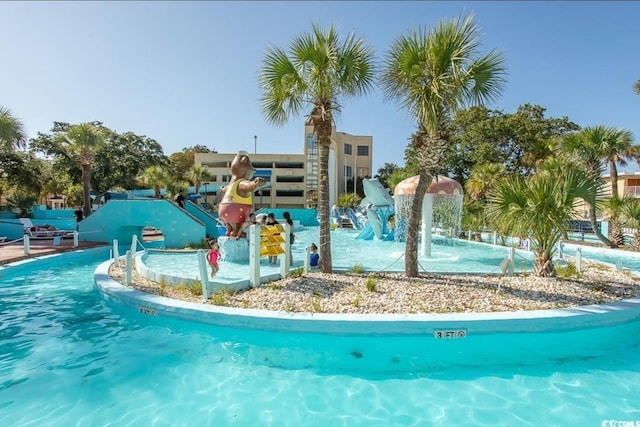 view of pool with pool water feature