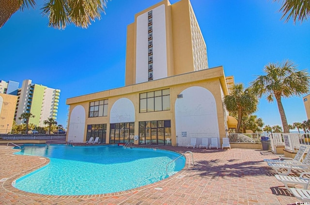 view of swimming pool with a patio area