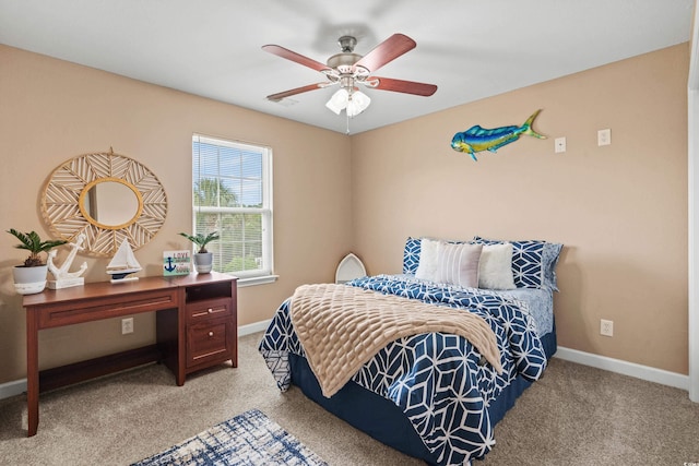 bedroom with ceiling fan and light carpet