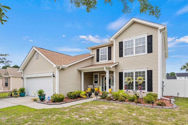 view of front of house featuring a front yard and a garage