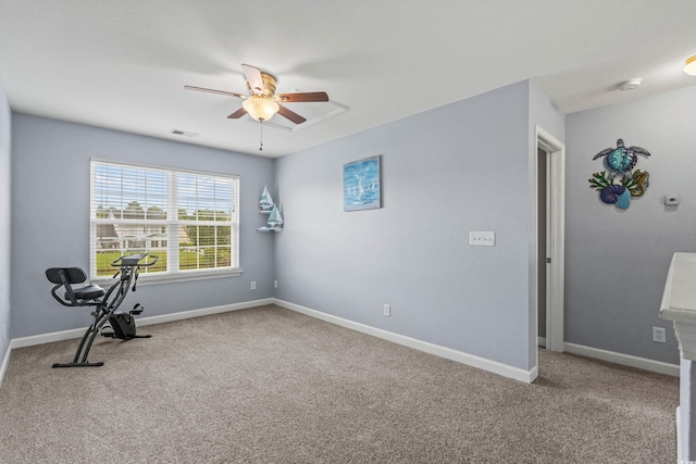 exercise room featuring ceiling fan and carpet floors