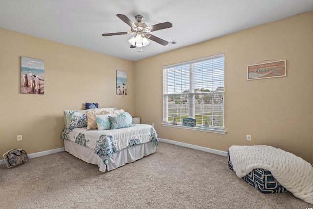 carpeted bedroom featuring ceiling fan