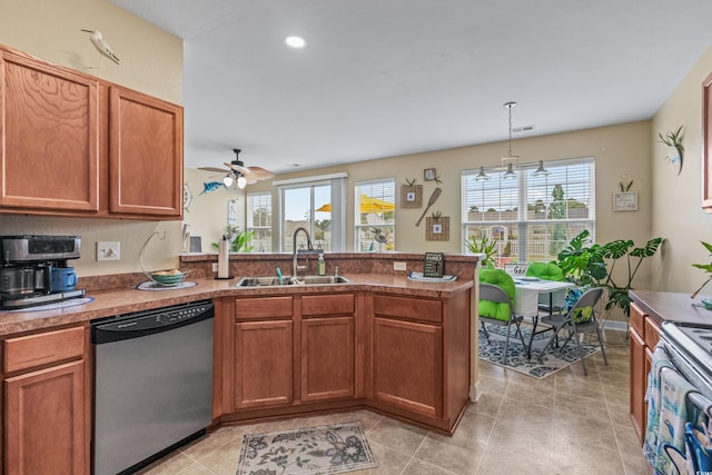 kitchen with stainless steel dishwasher, sink, range with electric stovetop, and plenty of natural light