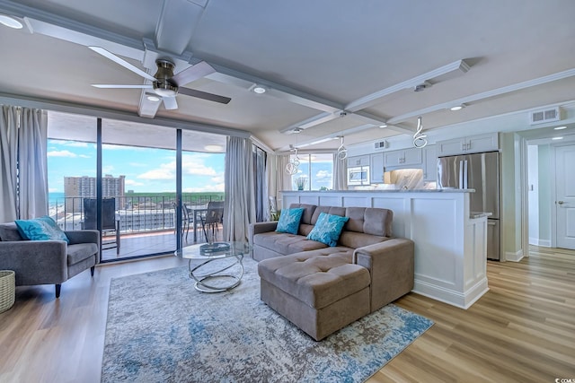 living room featuring beamed ceiling, coffered ceiling, ceiling fan, and light hardwood / wood-style flooring