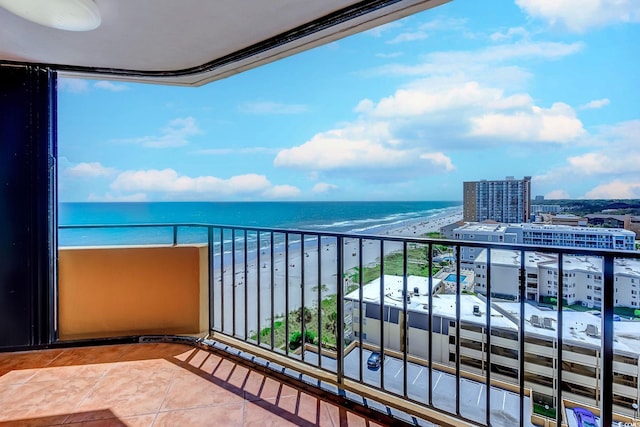 balcony with a view of the beach and a water view