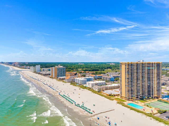 bird's eye view with a water view and a beach view