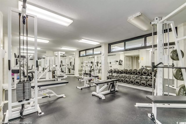 workout area with a textured ceiling