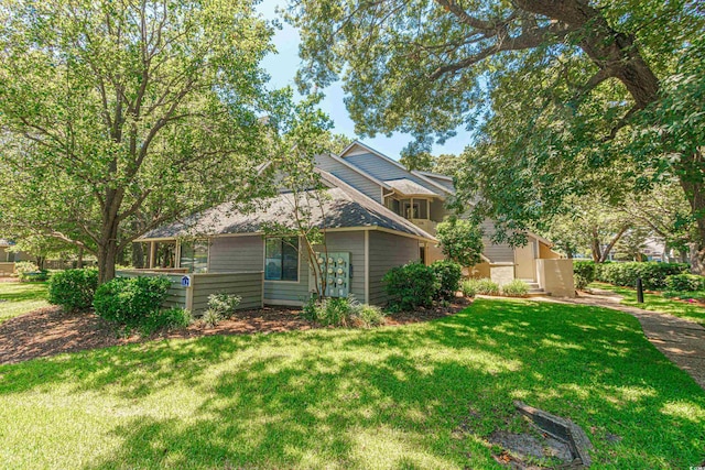 exterior space featuring a front lawn