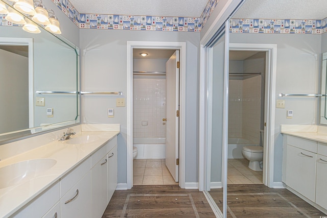 full bathroom with toilet, hardwood / wood-style flooring, and vanity