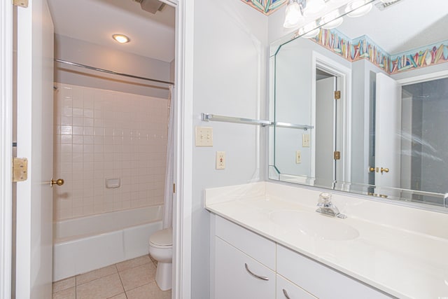 full bathroom featuring vanity, toilet, tile patterned flooring, and shower / bath combo with shower curtain