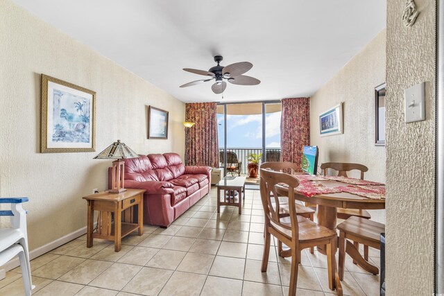 2500 N Ocean Blvd Unit 605, Myrtle Beach, SC 29577 - dining area with light tile patterned flooring, baseboards, a ceiling fan, and a textured wall