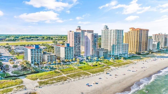 aerial view featuring a view of the beach and a water view