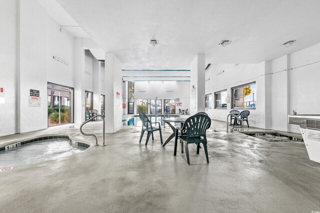 2500 N Ocean Blvd Unit 605, Myrtle Beach, SC 29577 - dining area with concrete floors and a high ceiling