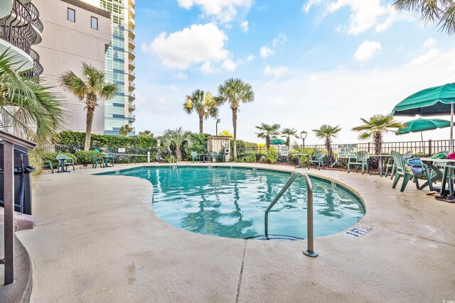 2500 N Ocean Blvd Unit 605, Myrtle Beach, SC 29577 - community pool with a patio and fence
