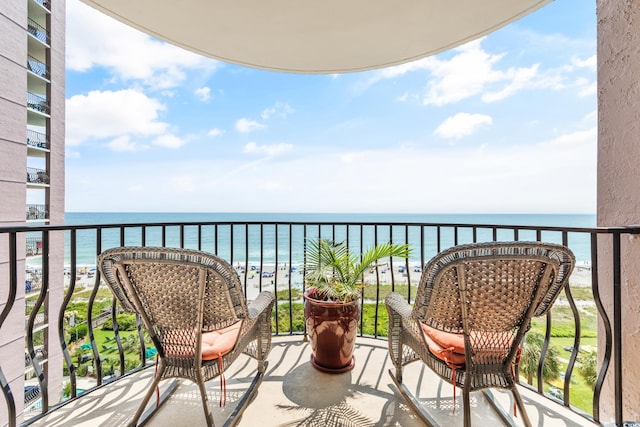 balcony featuring a water view