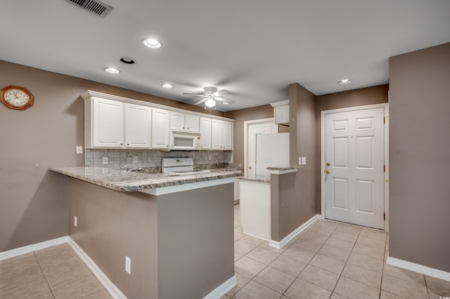 kitchen featuring backsplash, white appliances, white cabinetry, kitchen peninsula, and ceiling fan