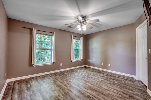 unfurnished room featuring ceiling fan and hardwood / wood-style flooring