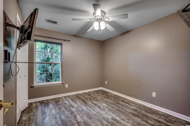 empty room featuring hardwood / wood-style floors and ceiling fan