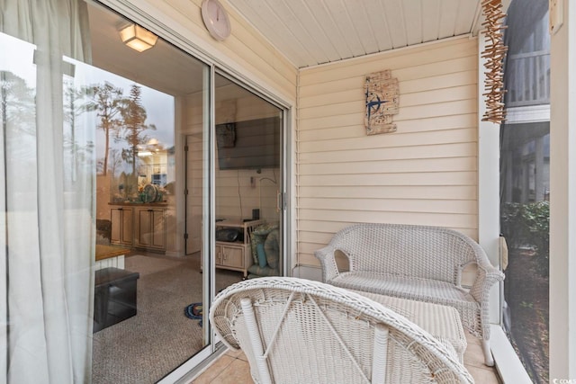 sunroom / solarium featuring wooden ceiling