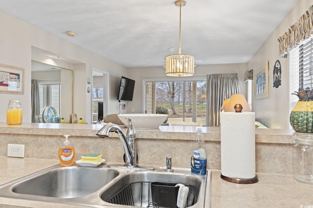 kitchen with a sink and pendant lighting