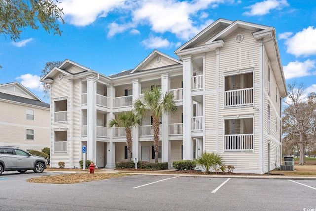 view of property featuring uncovered parking