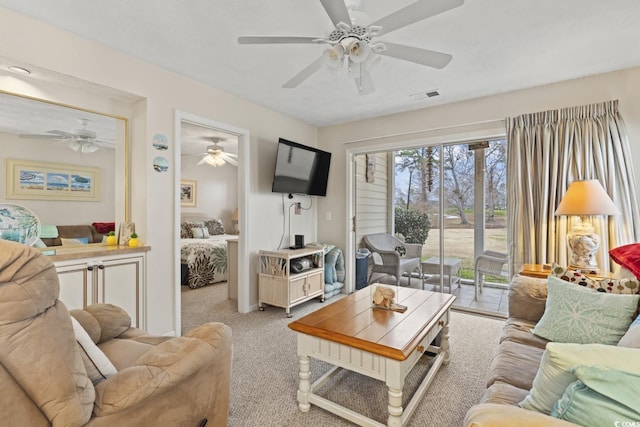 living area with carpet flooring and visible vents