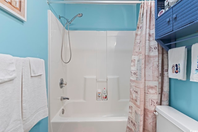 bathroom with toilet and shower / bath combo with shower curtain