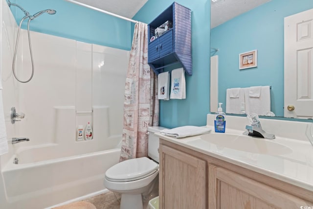 full bathroom featuring vanity, a textured ceiling, shower / bath combo with shower curtain, tile patterned floors, and toilet