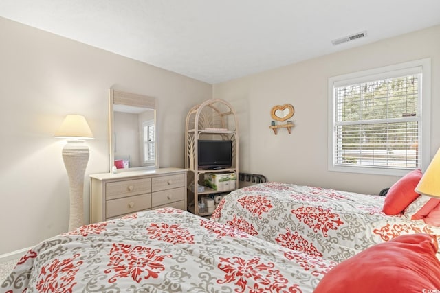 bedroom featuring visible vents