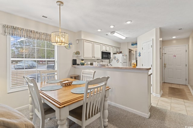 dining space featuring light tile patterned floors, recessed lighting, visible vents, and baseboards