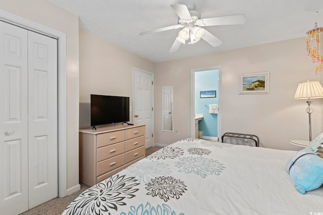 bedroom with ceiling fan, ensuite bath, a closet, and light carpet